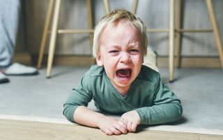 Child Screaming On The Floor