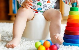 Child Sitting On Potty